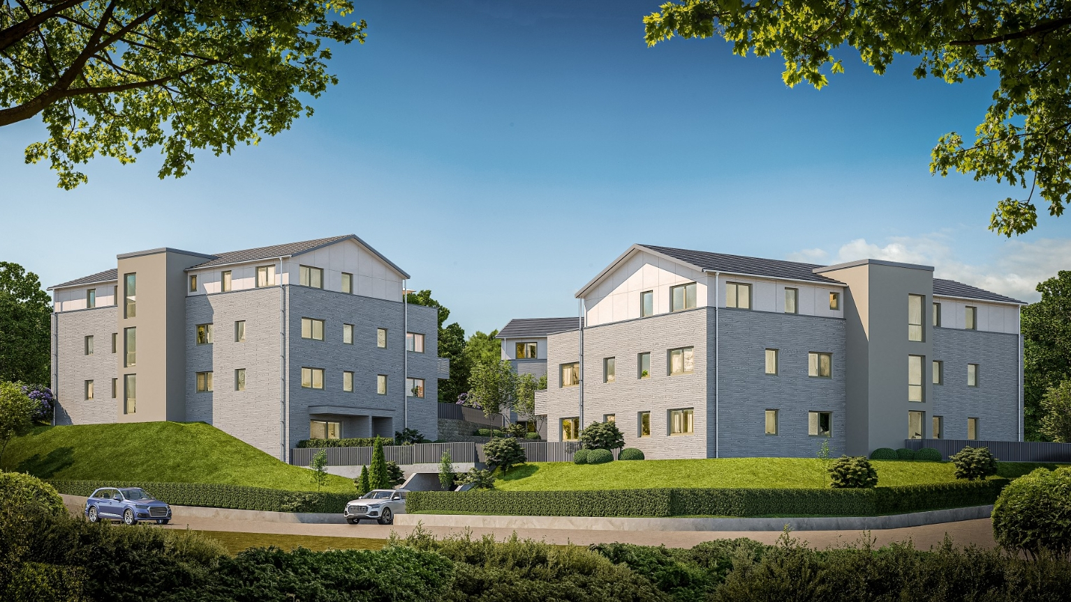 Ökologischer Wohnungsbau - kommunal und privat Dreiteiliges Wohnensemble in MHM Massivholzbauweise